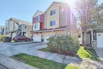 Building Photo - 3 Bed, 3.5 Baths Townhome With Garage Level Suite and Office Space