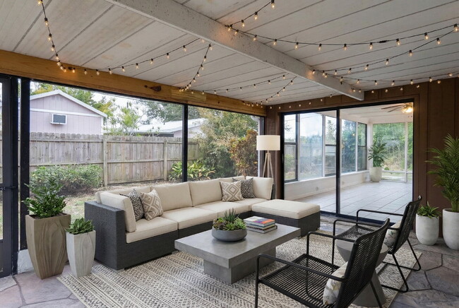 Building Photo - Recently painted 4BR/3BA home with tile floors throughout, fenced yard, detached garage, and prim...