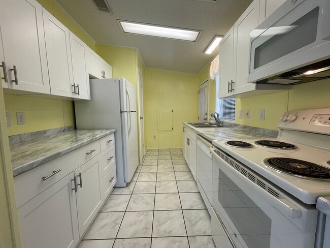 Building Photo - 2 BR 2 BATH Annual Rental in Barefoot Bay ...