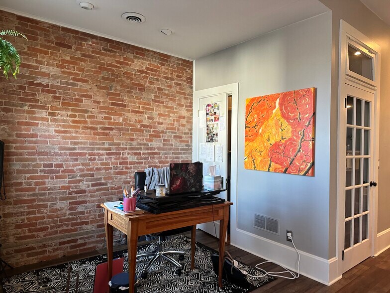 brick wall in living room - 1633 Main St