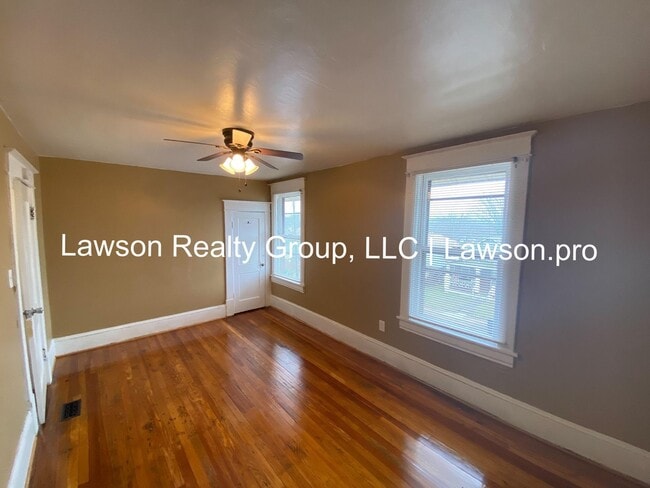 Building Photo - Updated Three Bedroom with Flat Yard