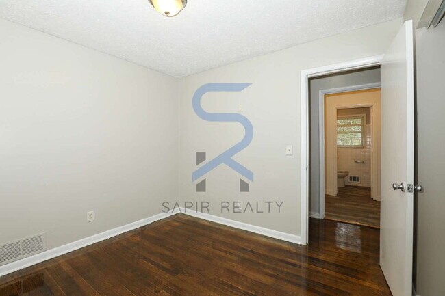 Building Photo - Timeless All-Electric Ranch Charm in a Vibrant, Peaceful Corner of South River Gardens