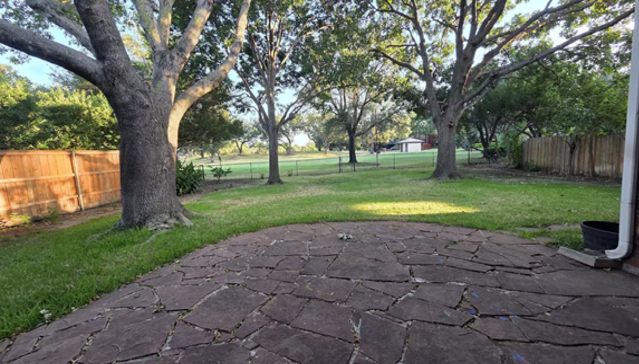 Savor a serene, fully shaded backyard oasis with premier views of the golf course - 10913 Alexandria Dr