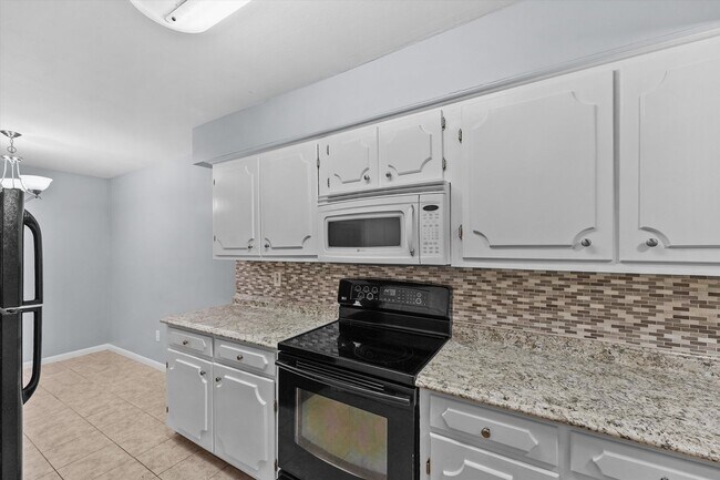 Building Photo - Bright & Updated 2-Bedroom Townhouse in Quiet Community with Pool Access!