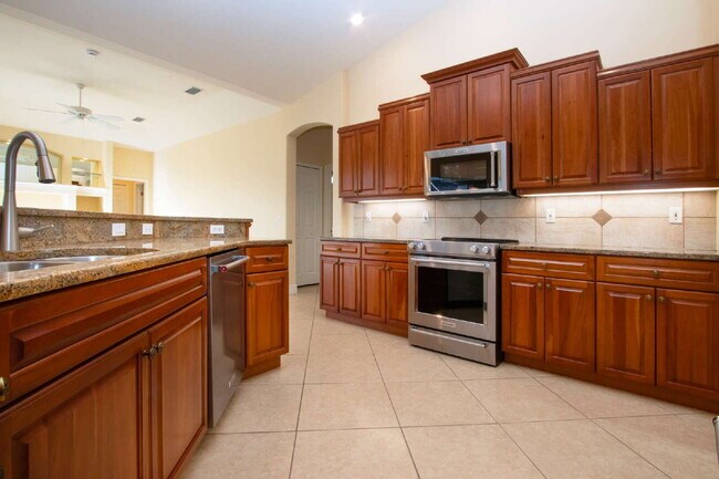 Building Photo - Rarely available executive home in The Hammocks is ready to rent on a long-term lease.