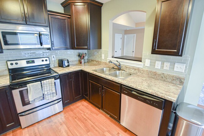 Building Photo - Pet Friendly Three Bedroom with Bonus!