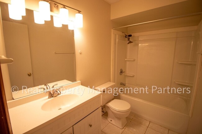 Building Photo - 2-Bed, 1-Bath Upper Unit with Garage & Porch – Steps from Paul Henry Trail