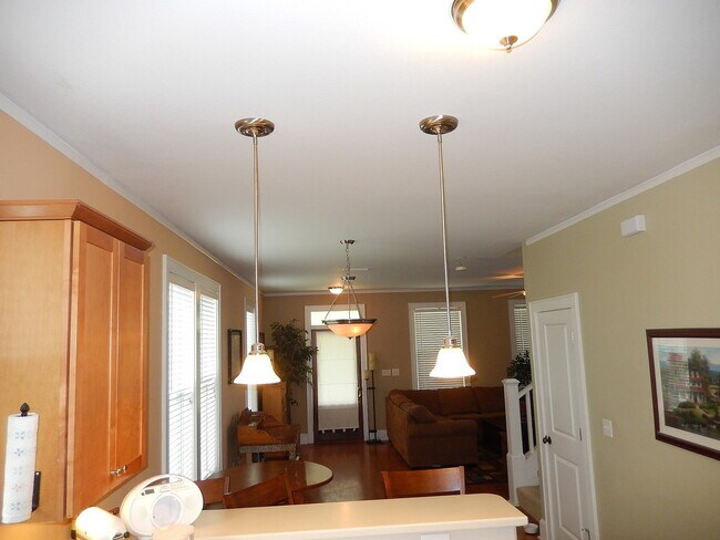 Building Photo - GLAMOROUS 3/2.5 w/ Pond View, Deck, Stainless Appliances, Wood Floors, Fireplace, & More! $2150/m...