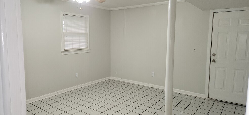 Bedroom 4/Bonus Room on lower level has exterior door. - 1447 Ridgeland Ct SW