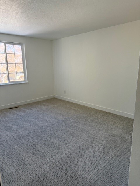 Building Photo - Modern finishes, spacious living, huge fenced backyard