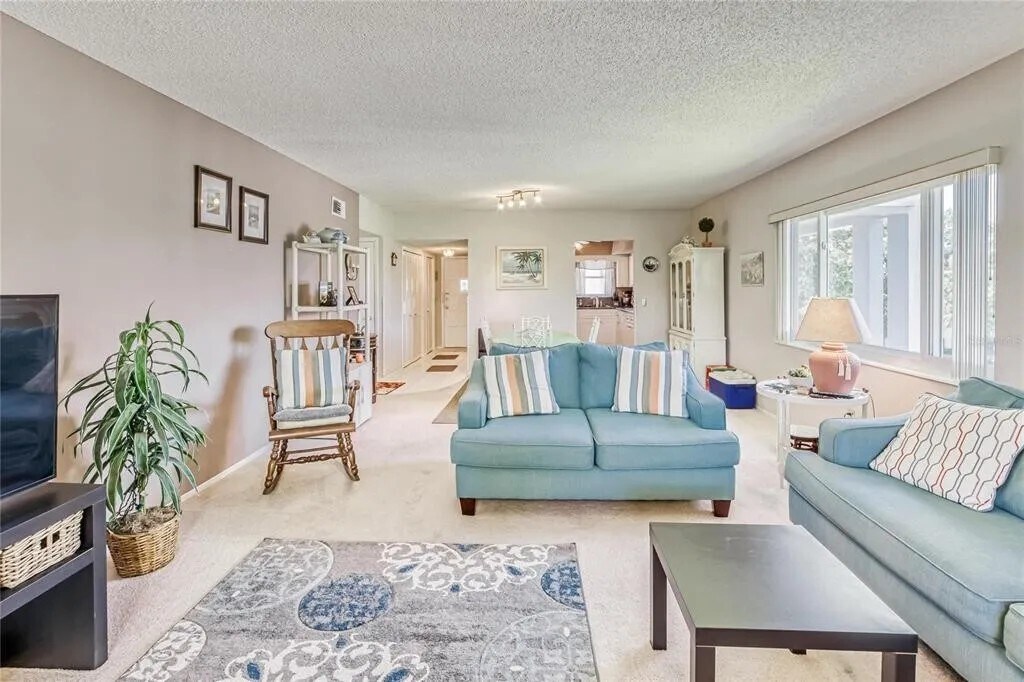 Living room looking towards dining area and kitchen - 2460 Franciscan Dr