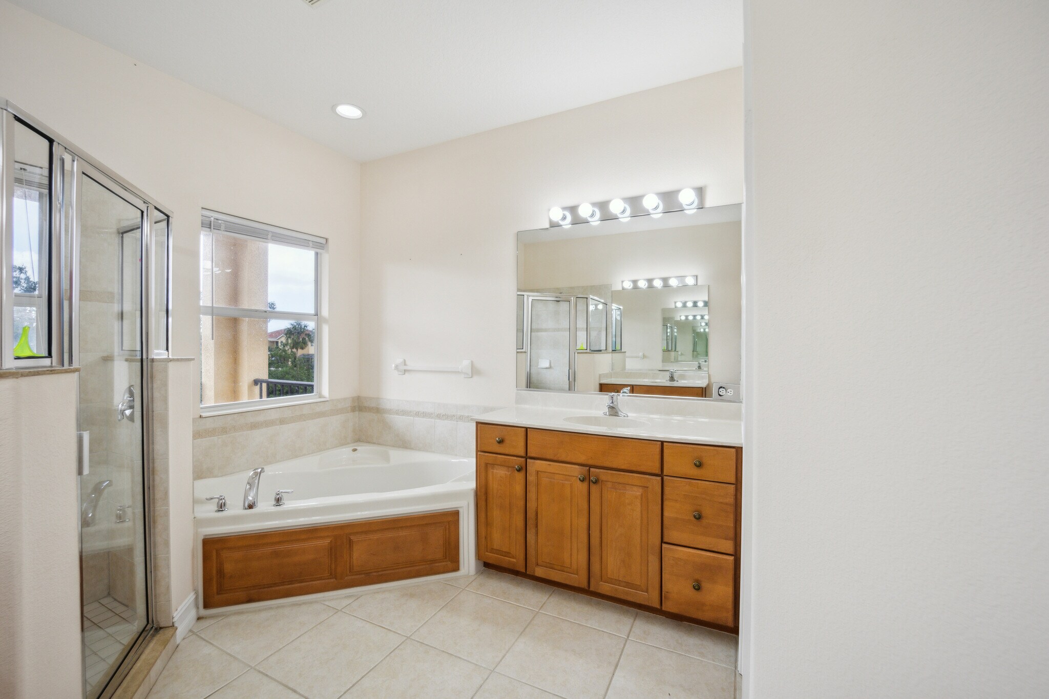 Master bath with two sinks. You can see the other in the mirror. - 1408 3rd Street Cir E