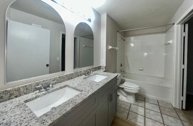 Building Photo - NEW-Remodeled bathroom & kitchen! NEW VINYL PLANK flooring & fresh paint! 2 bedroom 1 bath condo ...