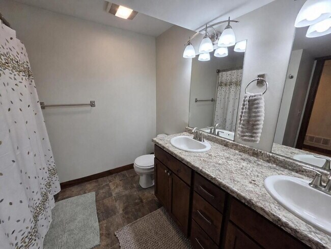 Building Photo - FREE SEPTEMBER RENT for this Spacious 4-Bedroom Home with Vaulted Ceilings with Finished Basement...