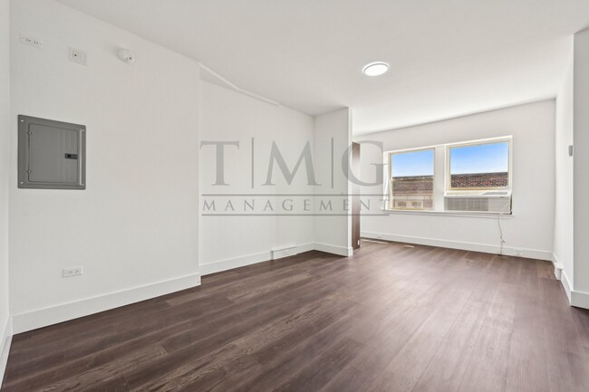 Building Photo - Sleek, Bright & Brand New — Stylish Studio...