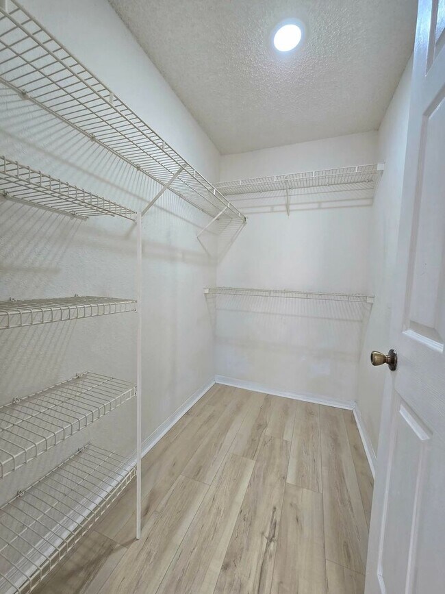 Building Photo - Beautiful 2BR/2BA Condo in Sunset Lakes – Lake & Tree Views!