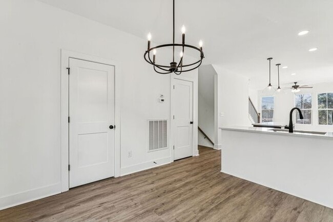 Building Photo - High-End 2BR Townhome | Rooftop Terrace + 2-Car Garage | 24-Unit Community