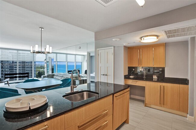 Building Photo - 10275 Collins Ave