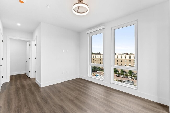 Building Photo - 2 Bedroom Corner-Unit with Wooded Balcony ...