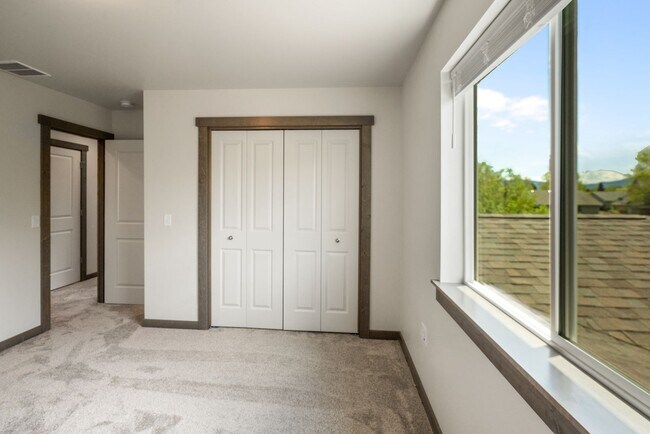 Building Photo - Pet Friendly! Gorgeous 3 Bedroom condo with double stall attached garages with AC.