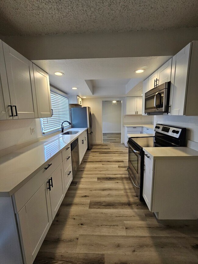 Building Photo - Updated 4BR Home | Pool + 2 Car Garage | Single Level