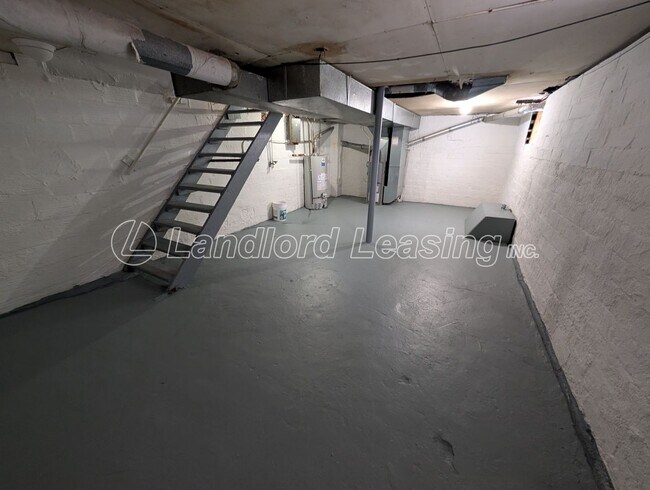 Building Photo - Updated Two-Bedroom Townhome with Lawn Care Included