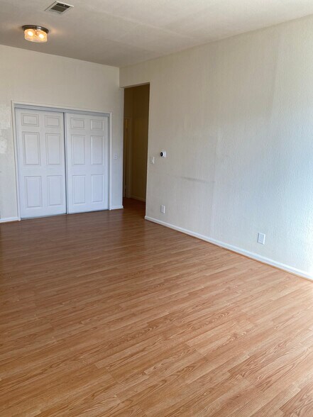 Ton's of storage, natural light, and hard wood floors in living room - 4179 Shafter Ave