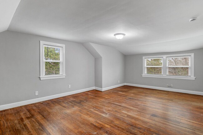 Building Photo - Brick home, Two Story, Hardwoods, DR, 2 Sun Rooms, FP, Carport!.