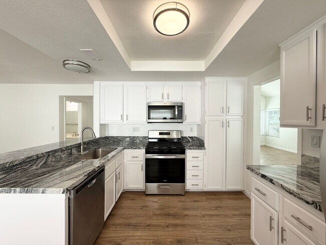 Building Photo - Corner Lot Beauty with Open Living, Guest Suite Down & Expansive Backyard
