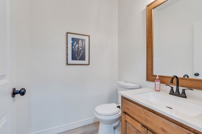 Powder room on main floor with large mirror and new vanity - 10441 S Sage Vista Way