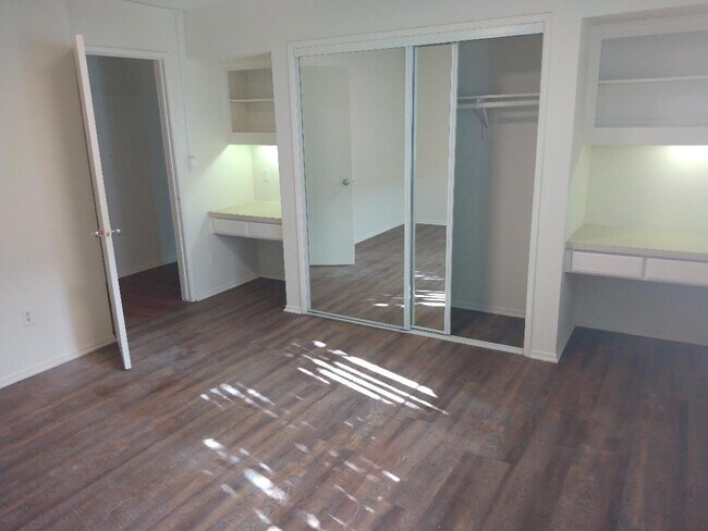 built in work desks with mirrored closet doors - 640 Veteran Ave