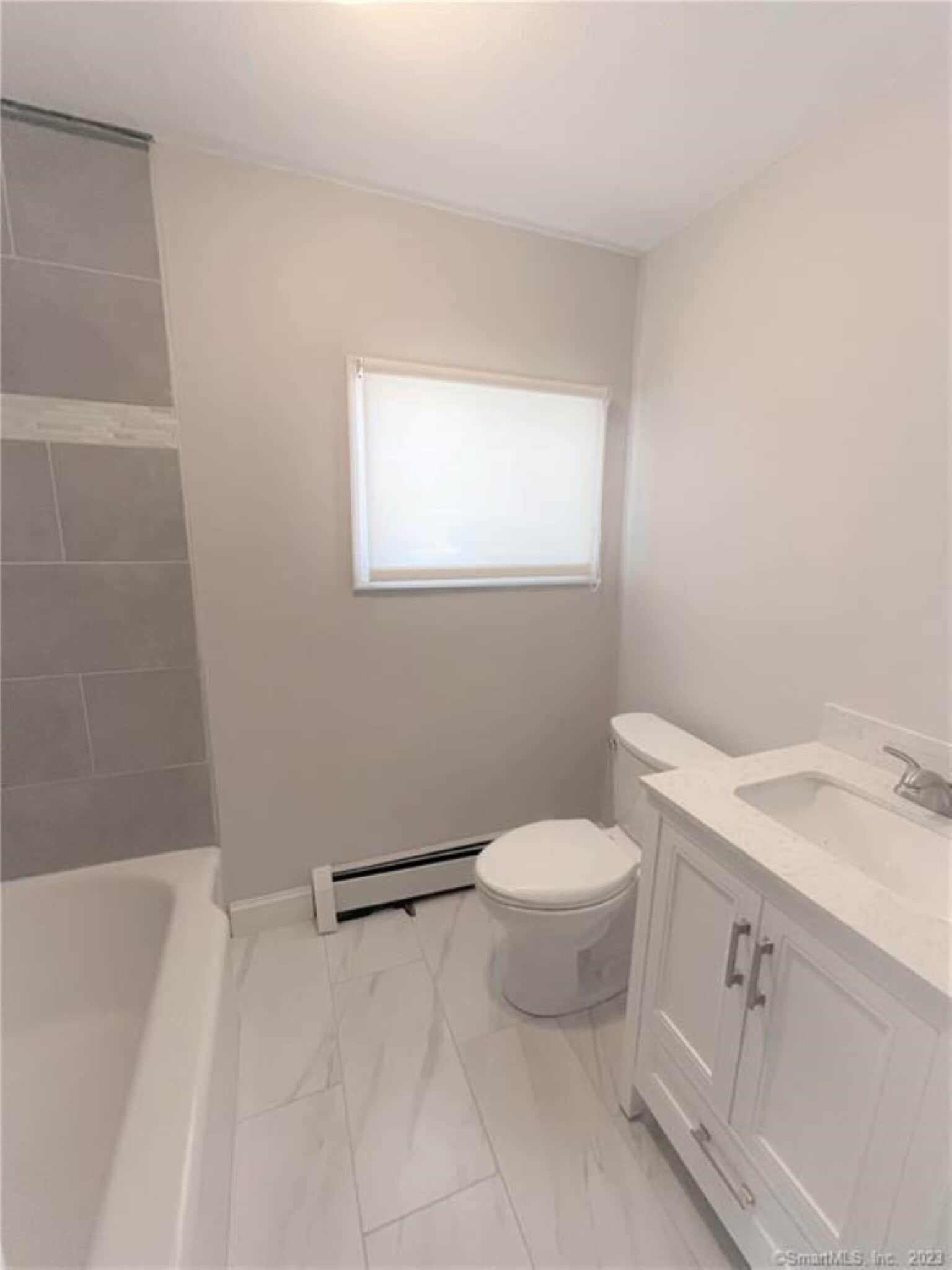 Full bath on second floor with a full tub and shower - 10 Treadwell St