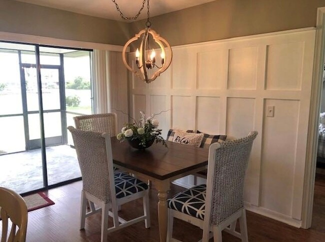 Dining area has a feature wall. - 2321 SE 5th Ct