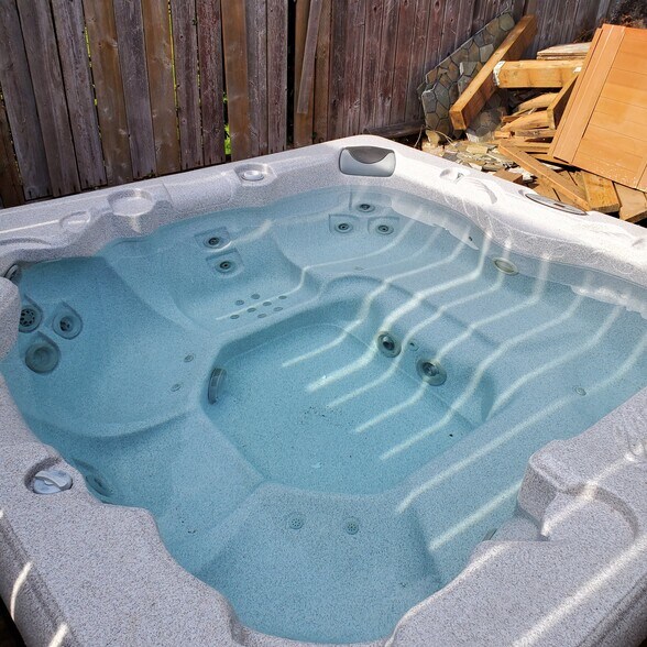 Hot tub in private fenced backyard - 24028 25th Ave S