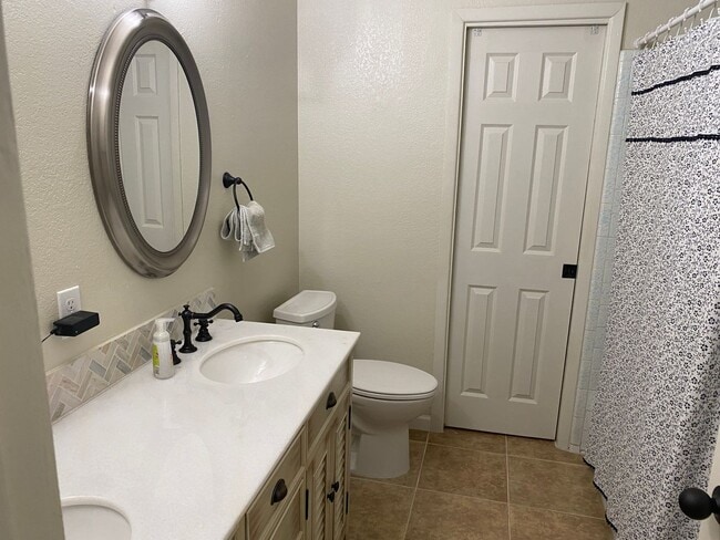 Building Photo - 3 bedroom home with large living room on a large corner lot with lots of room for play.