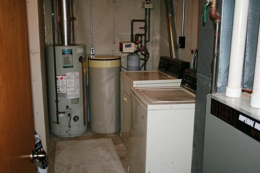 Washer and dryer hookups and water softener. - 981 11th Ave S