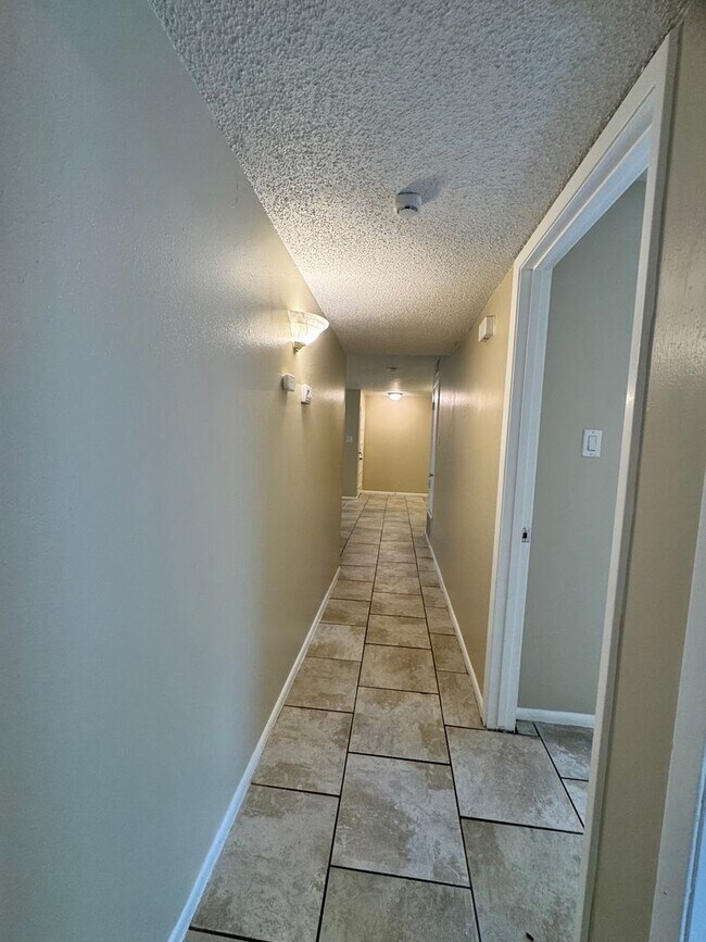 Building Photo - Single-level living on ground floor  |  Fresh paint (July 2026)  |  2 carports  |  Community Pool...