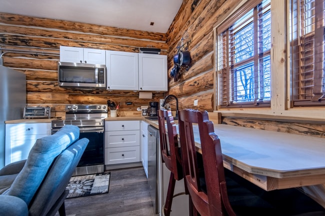 Building Photo - Charming Log Cabin and Carriage House – Do...