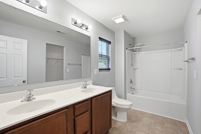 Building Photo - Spacious 4BR Home with New Carpet & Fenced Backyard