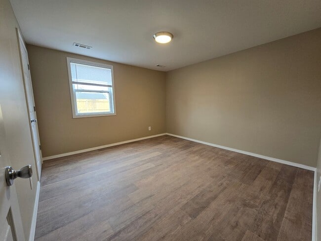 Building Photo - Corner Lot. Fenced Yard. Smells Like Fresh Paint & Good Decisions