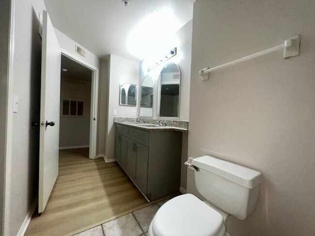 Building Photo - NEW-Remodeled bathroom & kitchen! NEW VINYL PLANK flooring & fresh paint! 2 bedroom 1 bath condo ...