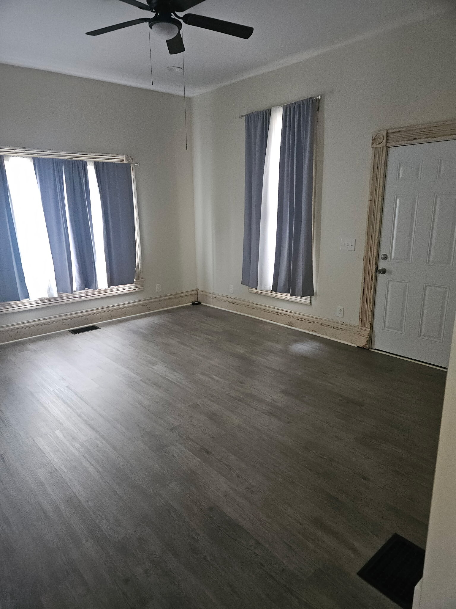 Living room with all vintage woodwork saved throughout the home. No cramped space here - 728 S 15th St