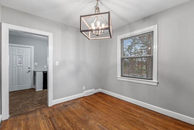 Building Photo - Brick home, Two Story, Hardwoods, DR, 2 Sun Rooms, FP, Carport!.