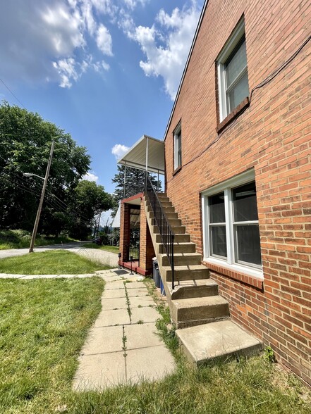 Separate entrance to unit 2 with outside staircase. - 1453 Woodbine St