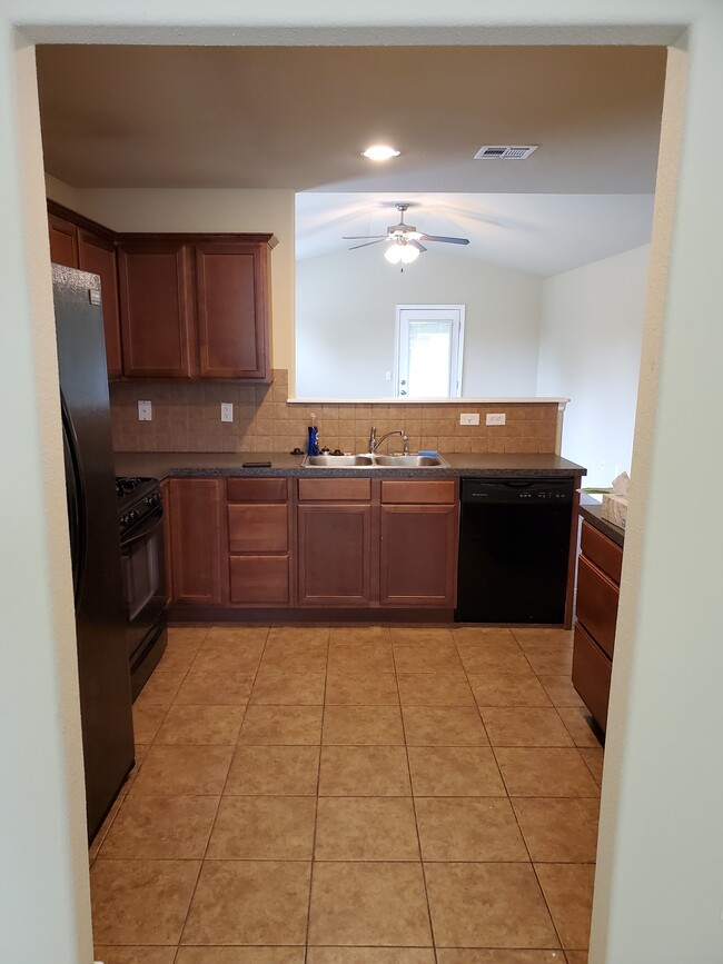 View into kitchen from dining room - 16021 S 83rd East Ave