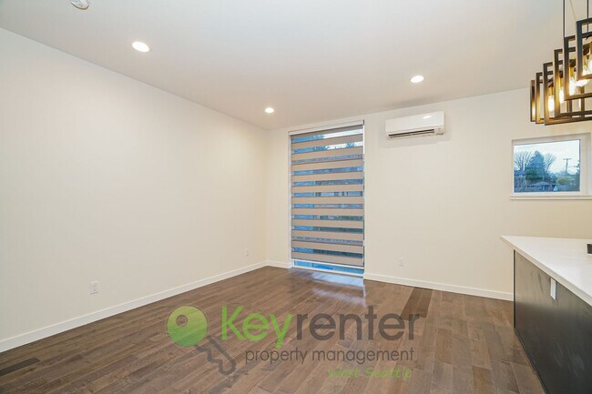 Building Photo - Rooftop Living with Open Concept Design and Parking Included