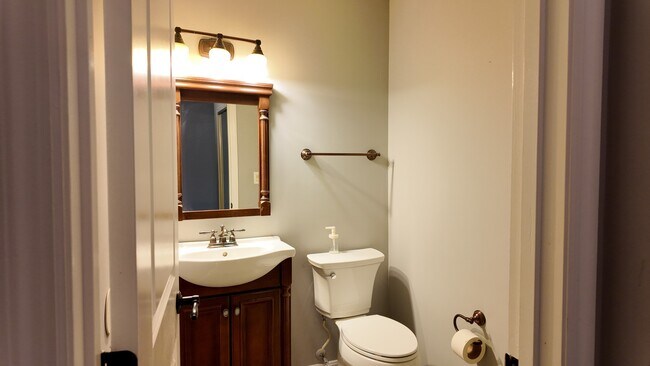 Building Photo - Spacious 2-Bed Townhome with Finished Basement, Pond View & Attached Garage in Fairfield