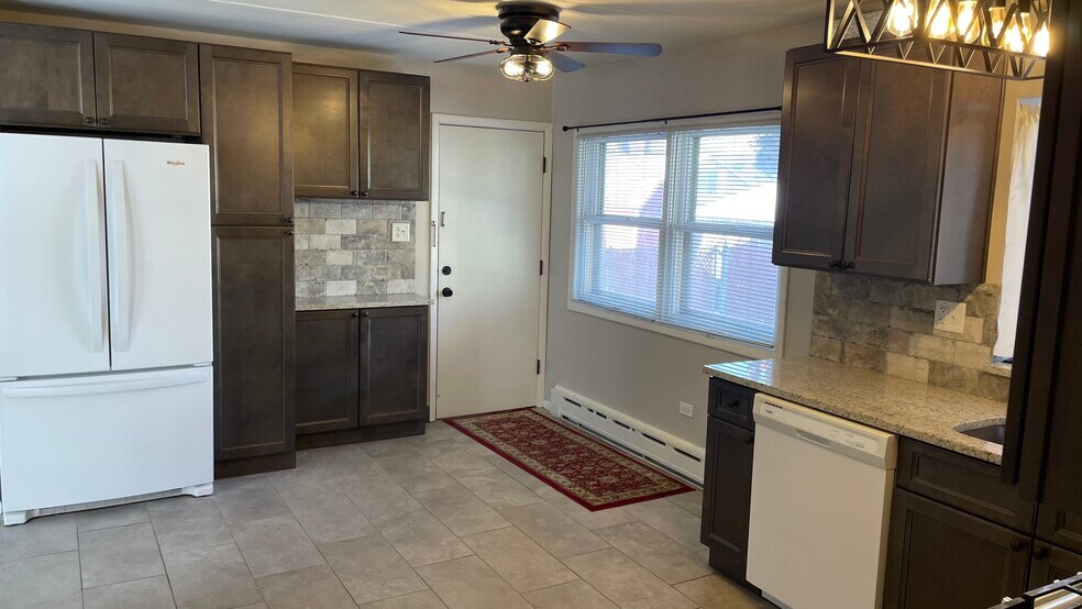 Back Door Enters In To An Amazing Open Dining Room/Kitchen W/ Italian Ceramic Tile Floors (Heated). - 2 N Broadway Ave
