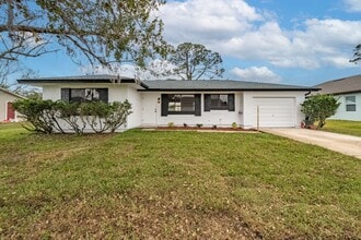 Building Photo - Charming Palm Bay Retreat - Perfect for Relaxation and Entertainment!