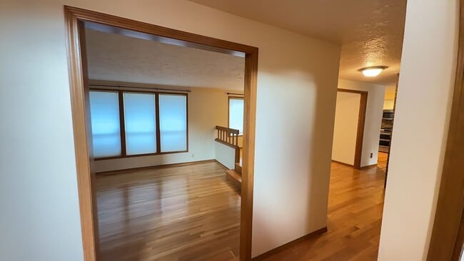 Building Photo - 4bd/3ba HUGE Home w/Hardwood Floors, Russian Fireplace, 2-Car Garage & Fenced Back Yard!